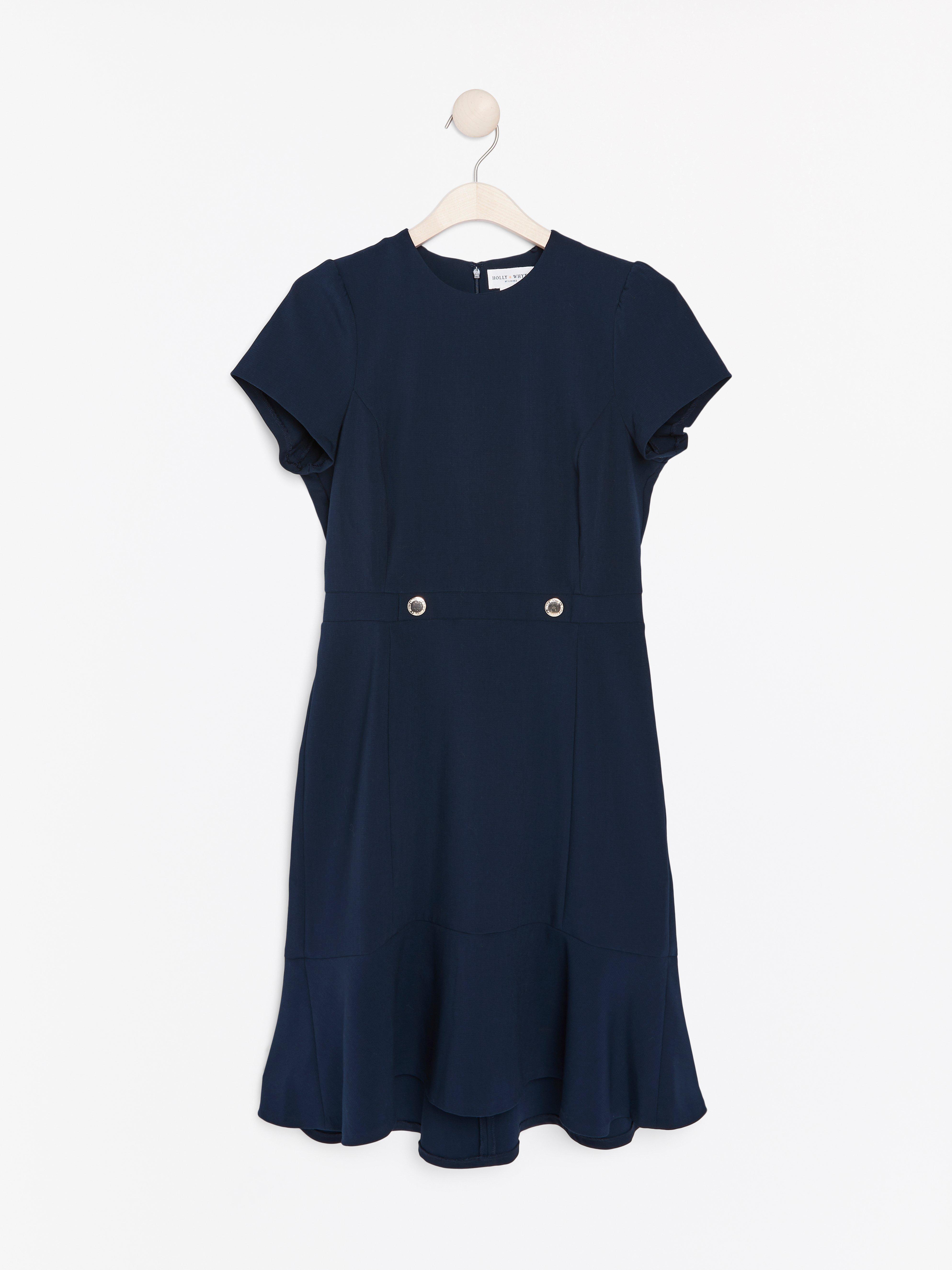 Marinblå klänning med volang