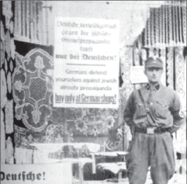 Boykott jüdischer Geschäfte, SA-Wache vor einem Laden.