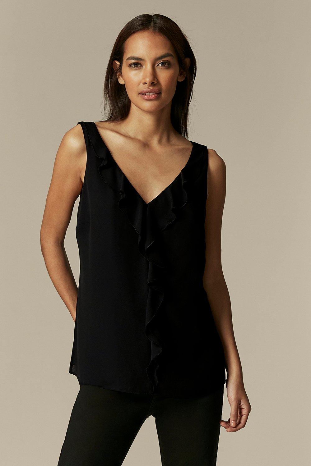 A Staple Black Camisole Top With An Extra Touch Of Style. Chic Ruffle Detailing Keeps This Top On-Trend, Whilst A Black Hue And Relaxed Fit Mean It'S Versatile And Flattering. For A Sleek & Evening Look, Wear With Black Tapered Trousers And Metallic Heels