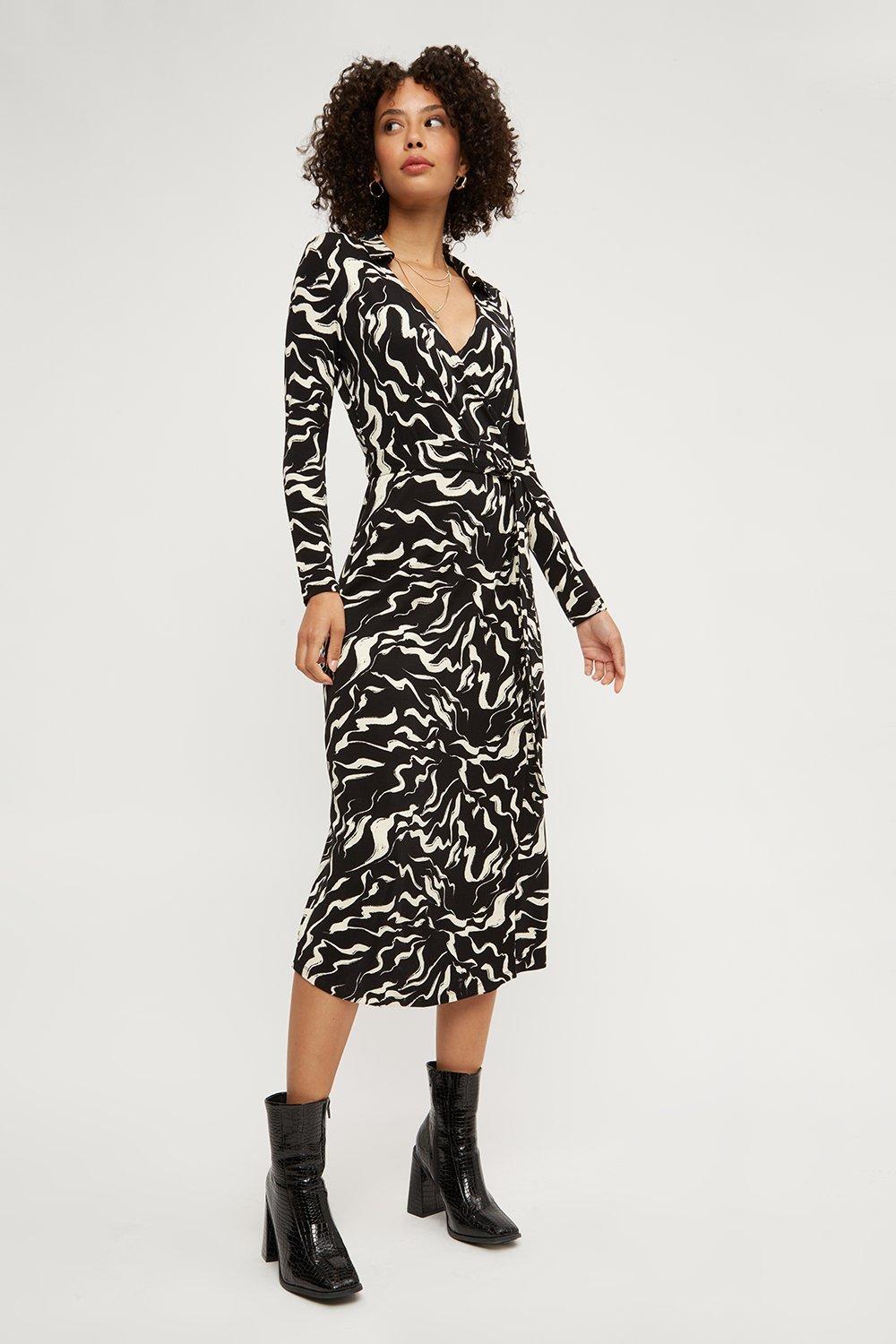 Click to view product details and reviews for Womens Abstract Animal Wrap Midi Dress.