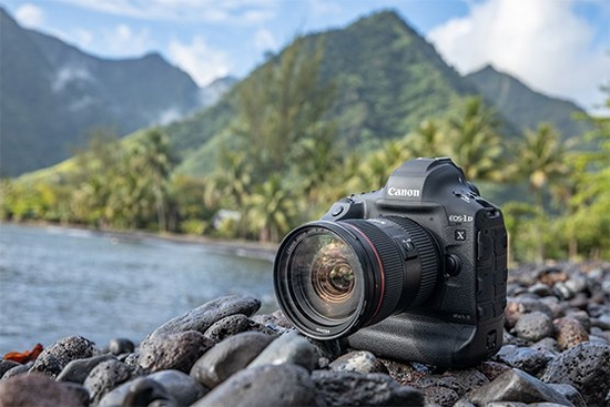 A Canon EOS-1D X Mark III on some rocks by the sea.