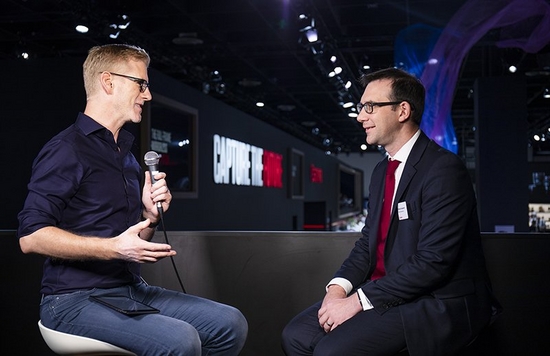 Image from an event of an interviwer interviewing a Canon Product specialist