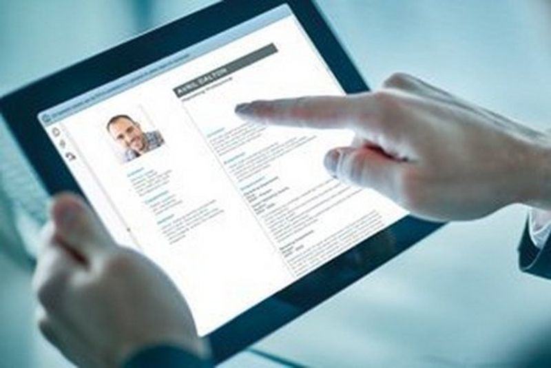 an image of an employee profile displayed on a tablet