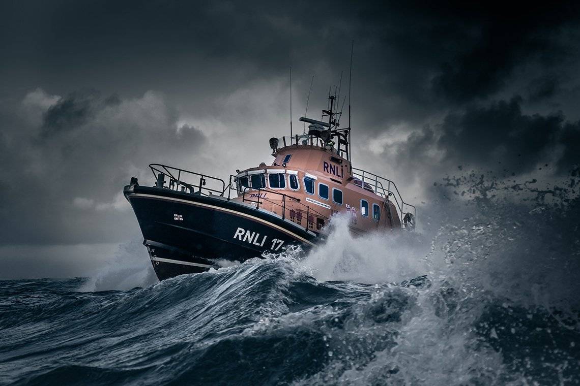 Islay’s RNLI lifeboat Helmut Schroder of Dunlossit II sailing through thrashing seas.
