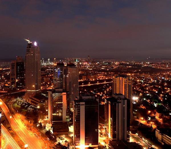 Beautiful night skyline view of tall buildings in Istanbul, Turkey.
