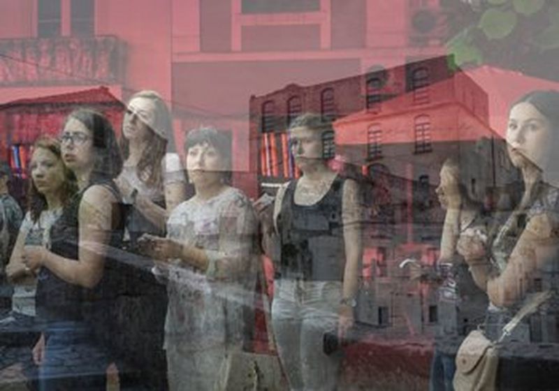 A group of young women, reflected in glass (© Rossena Petcova)