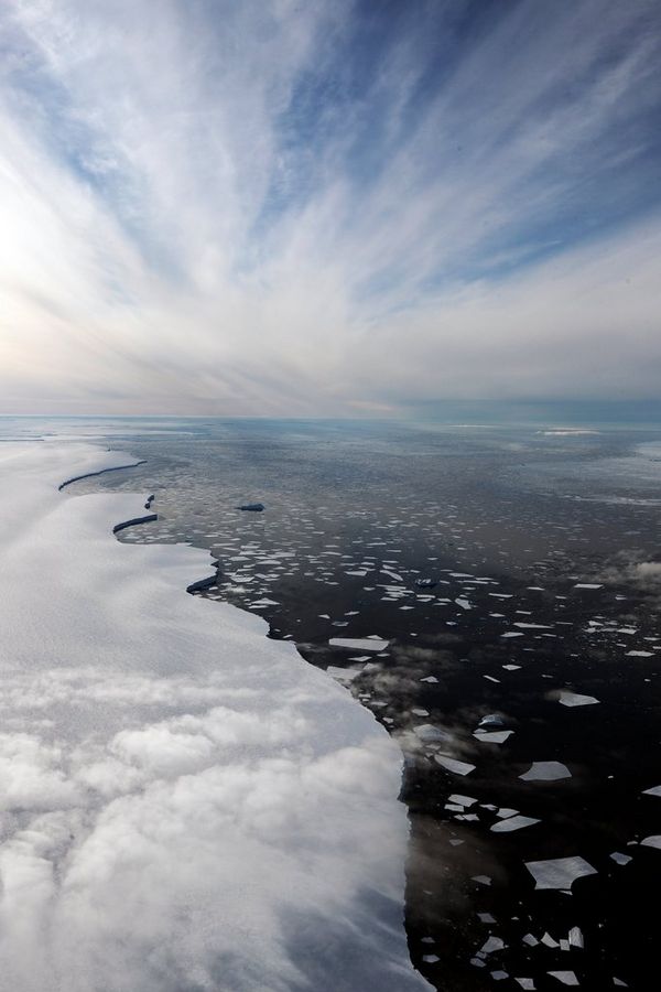 An aerial shot of clouds reflected on an ice sheet. Taken by Lucia Griggi.