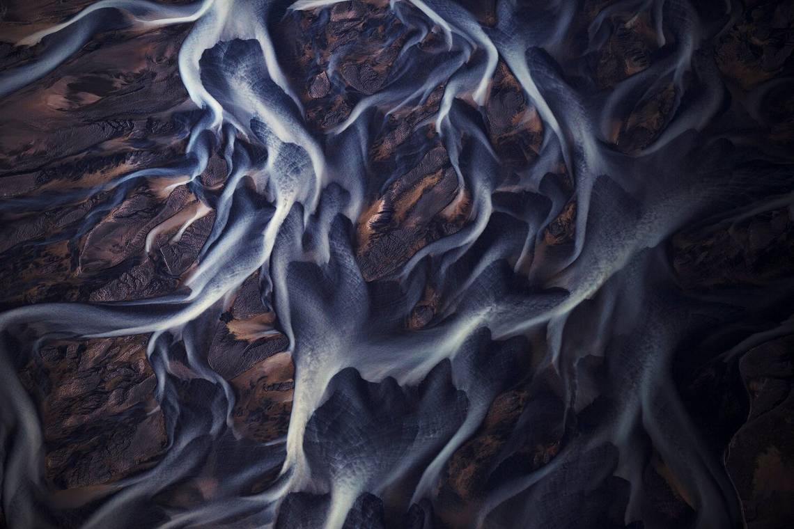 Braided rivers in Iceland photographed from above to reveal their winding patterns. Taken by Lucia Griggi.