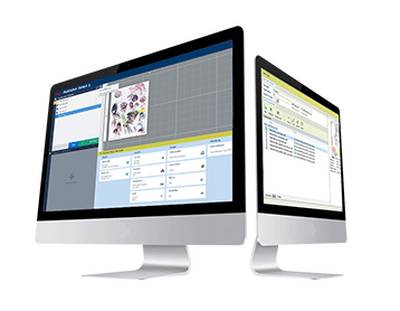Desktop computers displaying print work