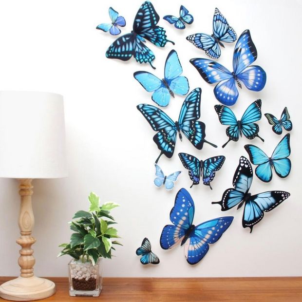 A wall decorated with blue butterflies. 