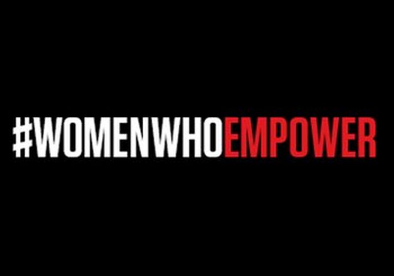 The words #womenwhoempower against a black background with '#womenwho' in white and 'empower' in red.