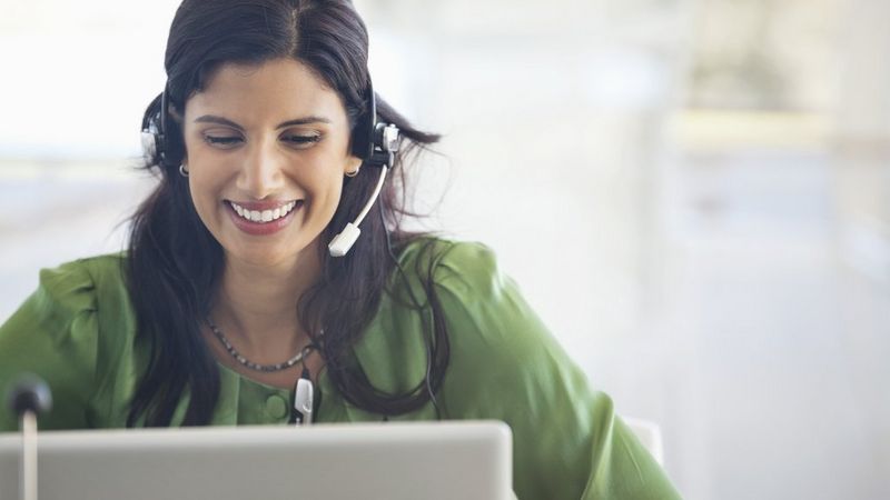 Work professional smiling with headphones on