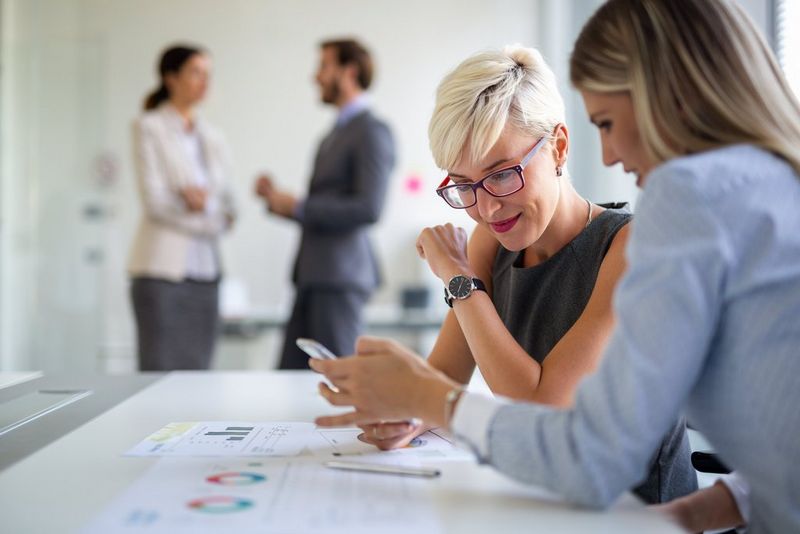 Two women in the office working together