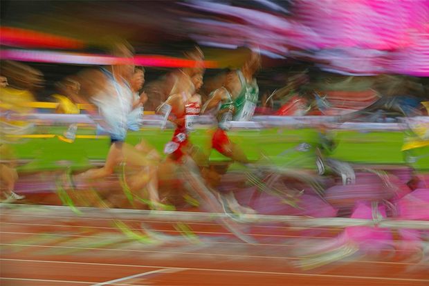 An image demonstrating motion blur of men running. Photo by Tom Jenkins.