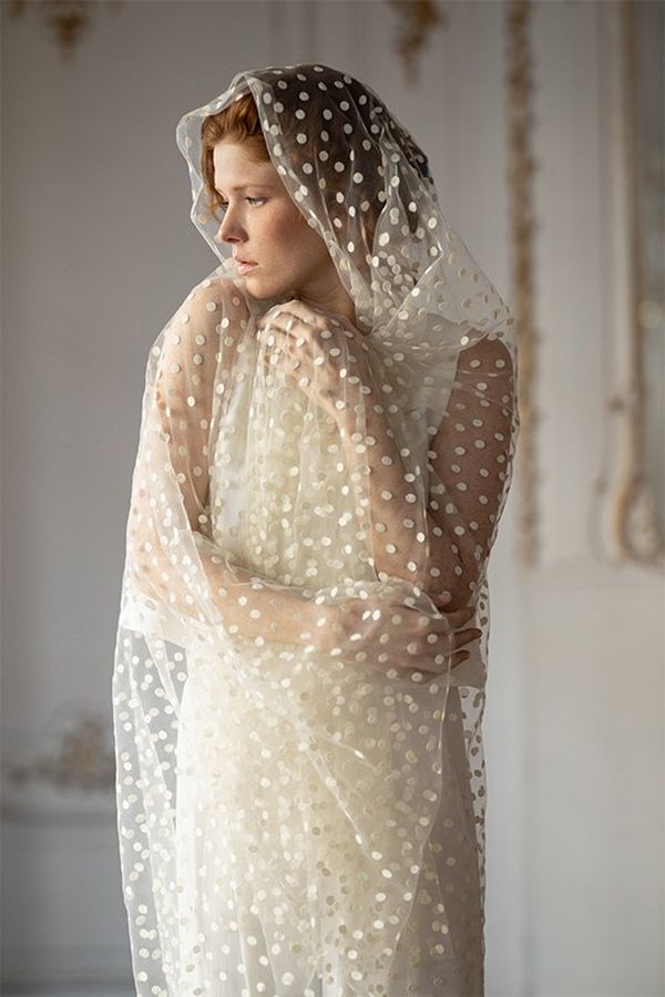A bride wears a sheer white fabric. Photo by Félicia Sisco with a Canon RF 85mm F1.2L USM lens.