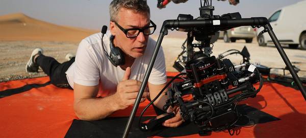 DOP Brett Danton adjusts a Canon EOS C200 mounted to a drone.