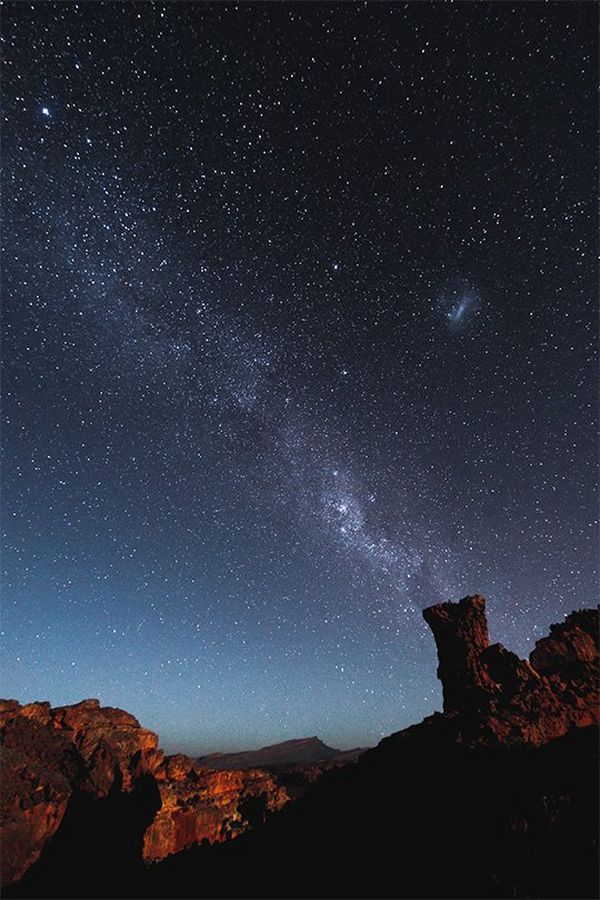 The Milky Way and stars above rock formations in South Africa.