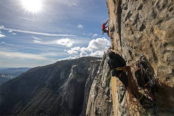 Two men scale the sheer cliff face of El Capitan in Yosemite National Park, where Oscar-winning documentary Free Solo was filmed using Canon equipment.