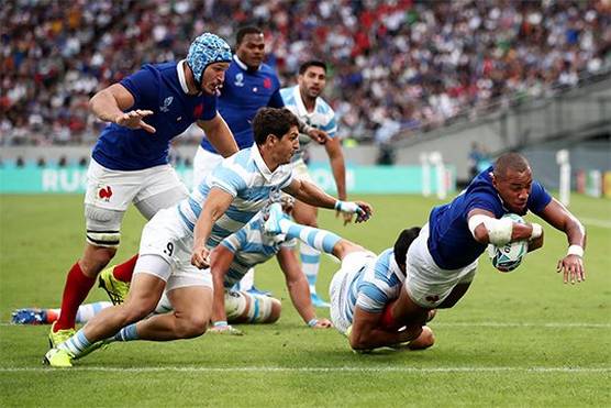 France rugby player Gaël Fickou dives to score a try against Argentina. Photograph by Cameron Spencer/Getty Images.