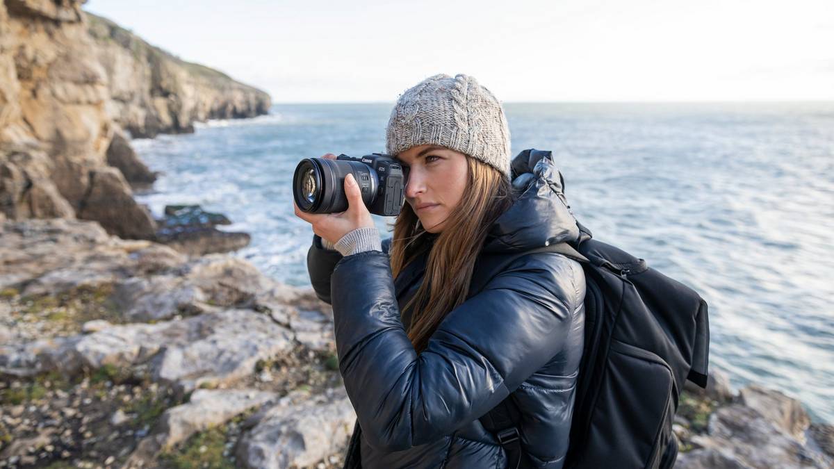 Lady wearing a grey beanie and blue coat while shooting on the EOS RP with RF 24-105mm F4-7.1 IS STM