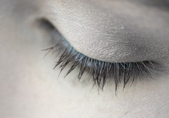 A close-up on a woman’s face – left eye and side of nose