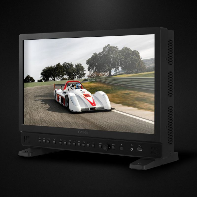 The Canon DP-V1830 monitor showing a racing car speeding along a countryside track. 