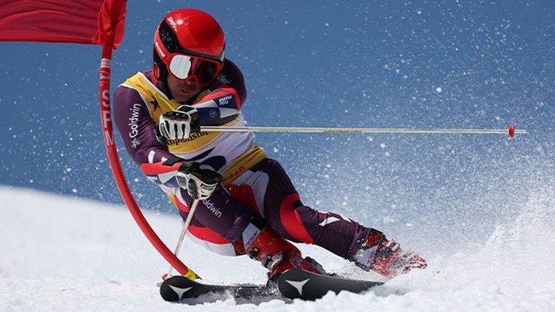 A skier going down the slope.