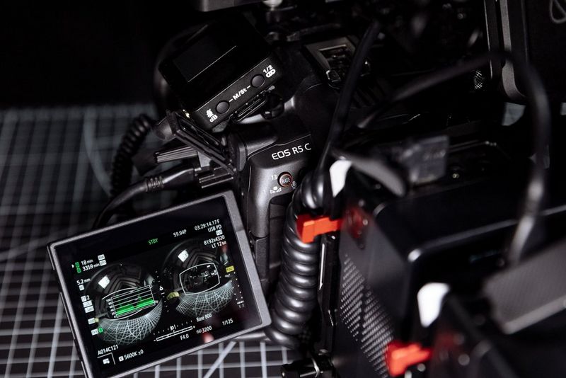 The screen of a Canon EOS R5 C shows the waveform of a video being recorded with a Canon RF 5.2mm F2.8L DUAL FISHEYE lens. 