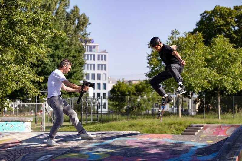 Martin Bissig films a skateboarder using a Canon EOS R5 on a handheld rig.