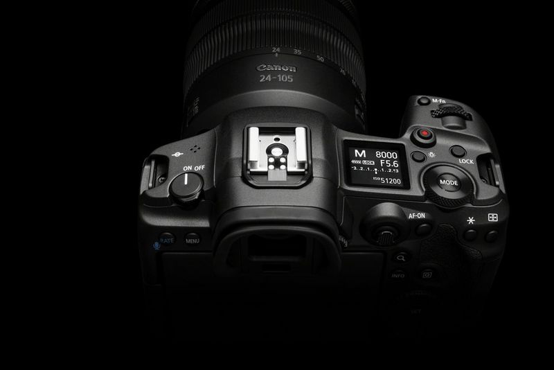 The Canon EOS R5, showing the mode button and LCD panel on top, to the right of the viewfinder.