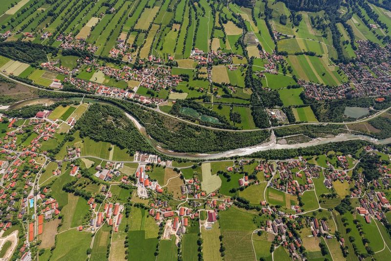 An aerial view over a town and the surrounding countryside.