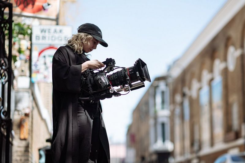 Filmmaker Diana Olifirova holds a Canon EOS C300 Mark III on a shoot in the city of London.