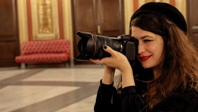 Wanda Martin seeing through the lens attached to Canon EOS R6