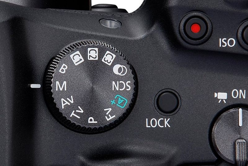 A close-up of the mode dial on a Canon EOS R7 set to Manual mode (M).