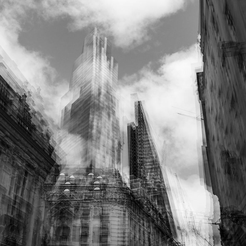 A black and white multiple exposure of a skyscraper. 