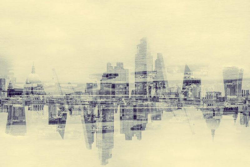 An overlaid shot of a mirrored London skyline. 