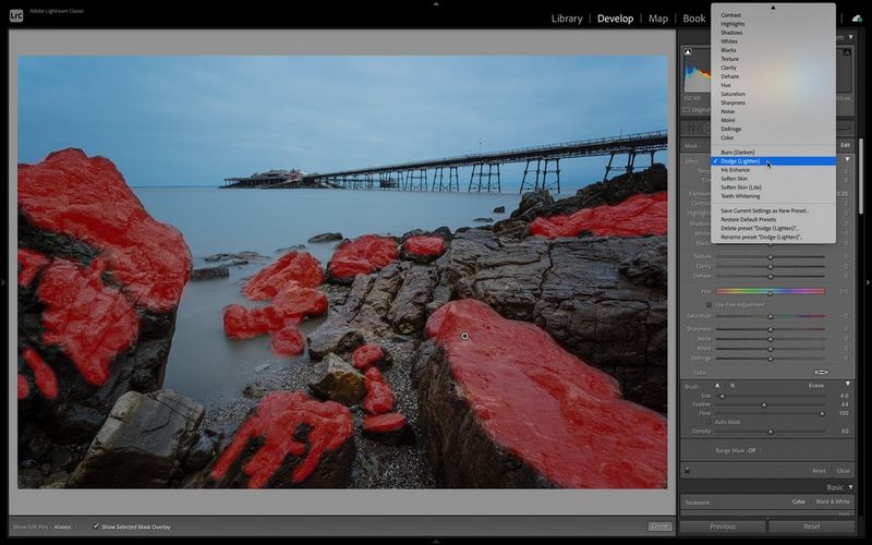 A screenshot of Adobe® Lightroom® showing a coastal landscape with a selection mask indicating where dodge is being applied.