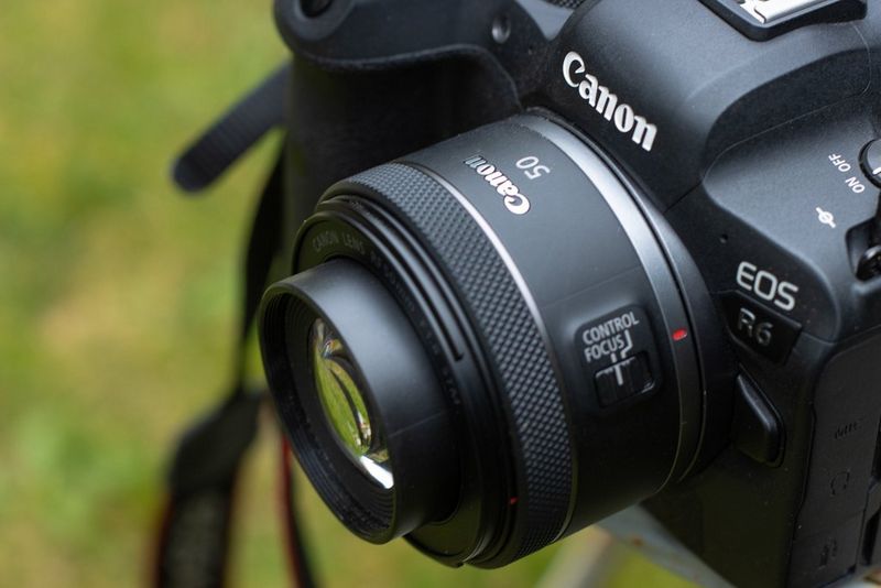 A close-up of a Canon 50mm lens attached to a Canon EOS R6. 