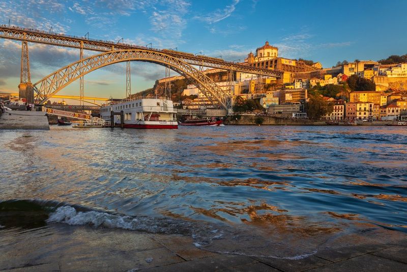 The sun sets over the Douro River in Porto, Portugal. Taken on a Canon EOS R6 with a Canon RF 24-105mm F4-7.1 IS STM lens.