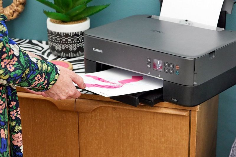 A colourful ice cream template printed from Canon's Creative Park emerges from a Canon PIXMA printer.