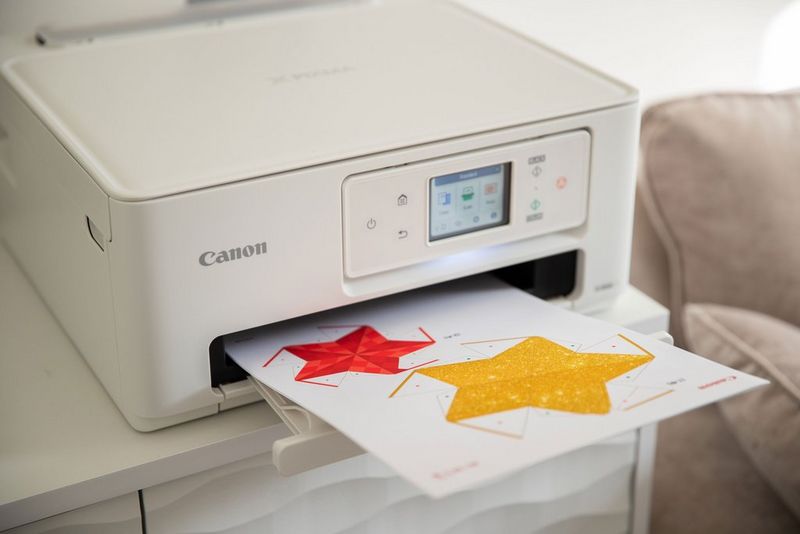 Creative Park papercraft star templates emerging from a Canon PIXMA printer.