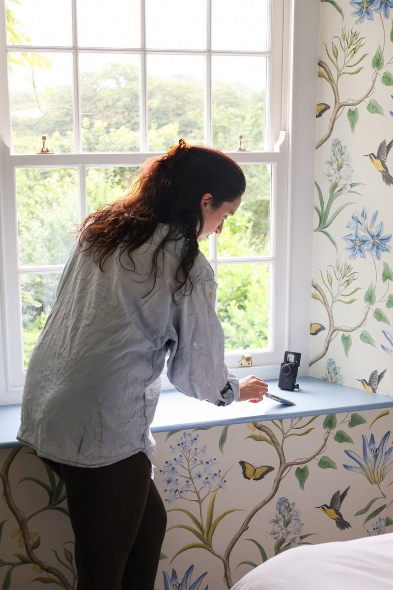 A Canon PowerShot V10 is set up on its stand on a window ledge in vegan food and lifestyle vlogger Madeleine Olivia's cottage.