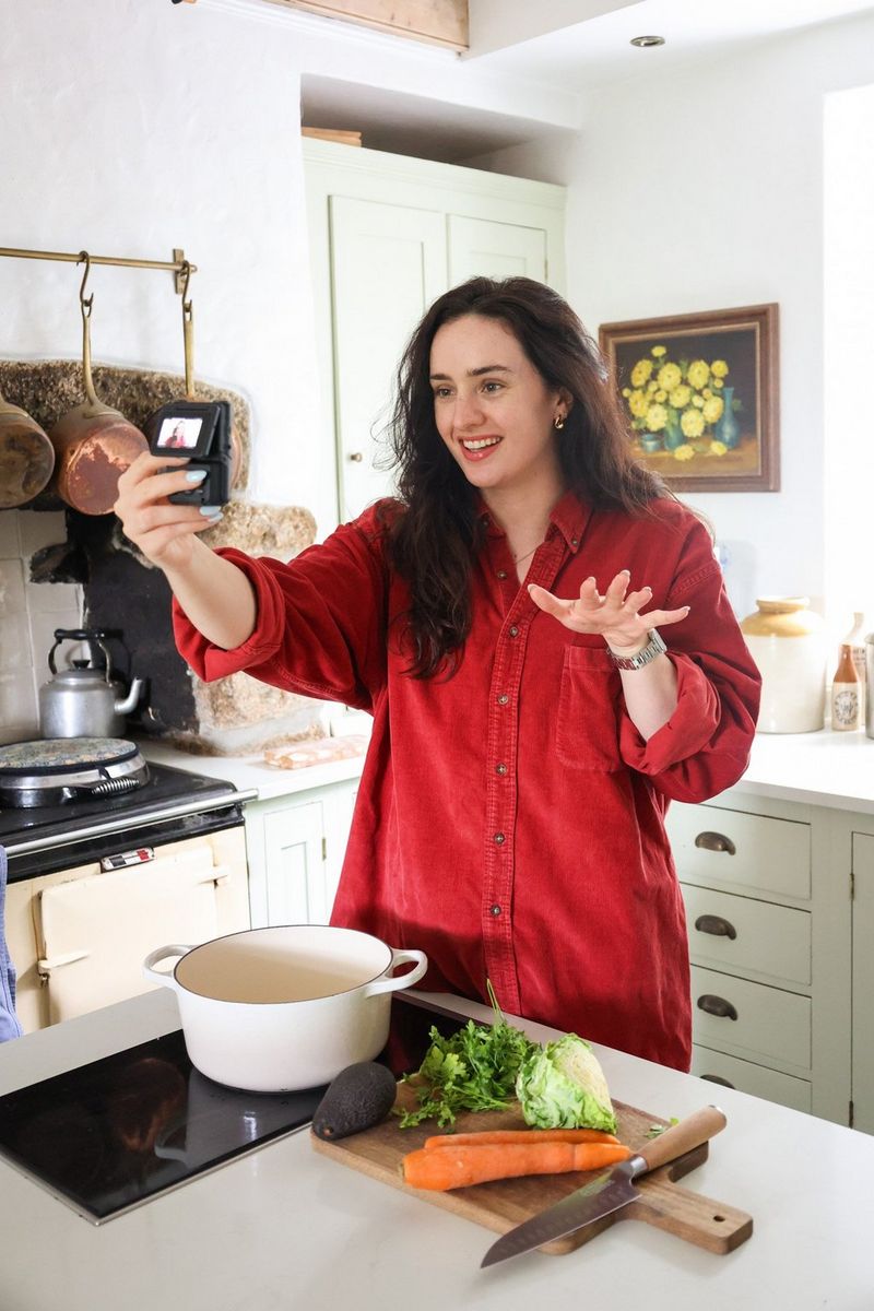 Vegan food and lifestyle vlogger Madeleine Olivia films herself preparing a recipe in her kitchen with a Canon PowerShot V10.