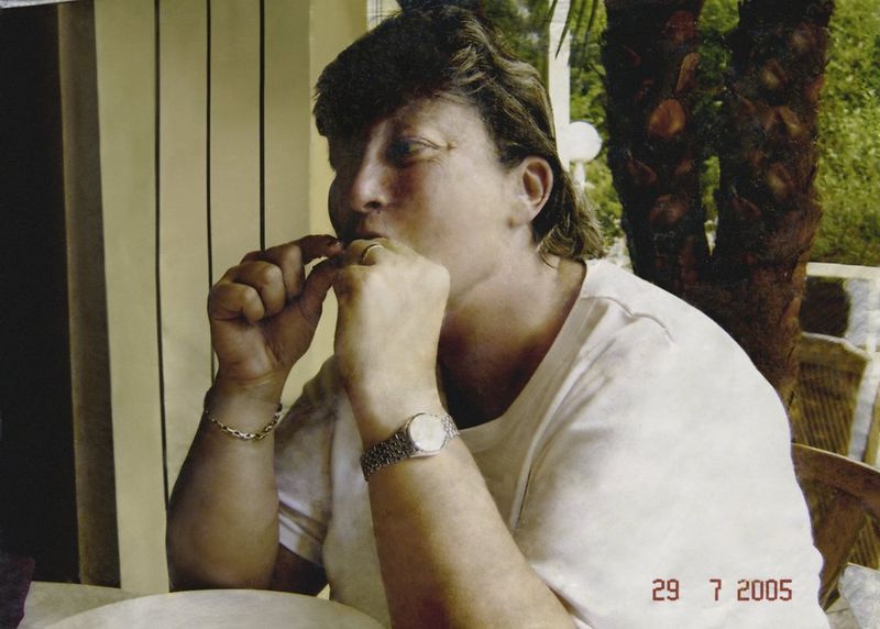 A retouched photograph of a woman eating.