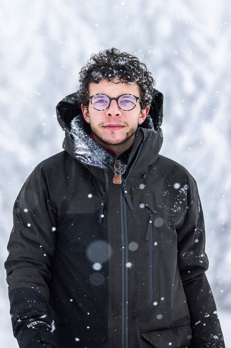 A portrait of Canon Ambassador Michel d'Oultremont standing in the snow. 