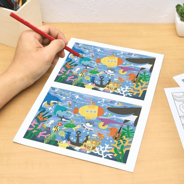 A printed colouring in page showing spot the difference.