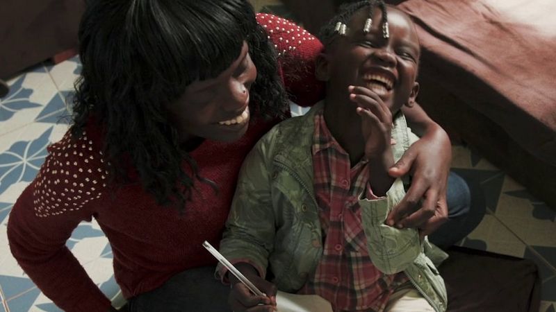 a woman and child laughing