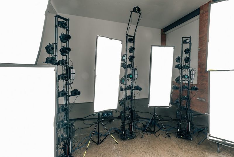 Some of the lighting rigs and camera arrays in a 3D photogrammetry studio setup.