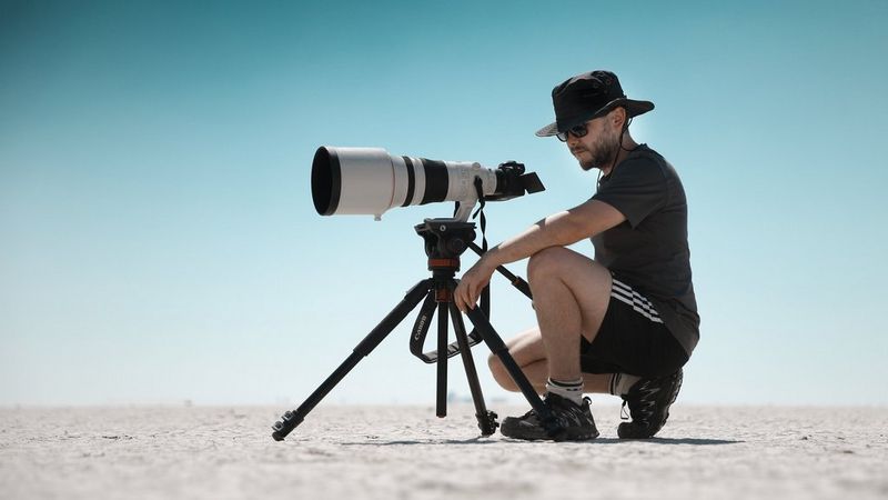 A photo of Canon Ambassador Burak Günaydin with a Canon camera on a tripod.
