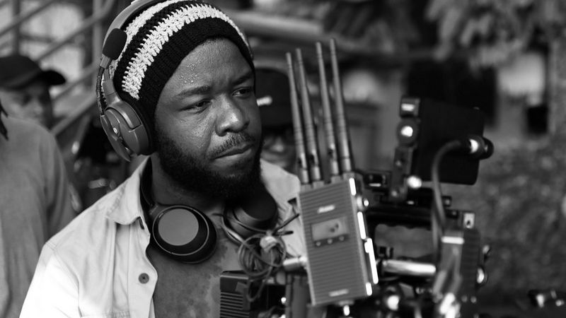 A black and white headshot of Canon Ambassador Daniel Ehimen